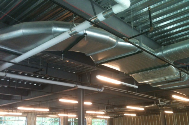 Installation of ductwork above ceiling at MCR Saftey Office